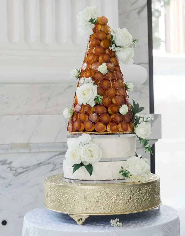 New favorite wedding trend alert!! Croquembouche 🍰 We love seeing couples utilize their dessert as another decor element!

Photography @niandxiaophotography 
Planner @wilsondesignsandevents
Rental @selecteventgroup
HMA @truecolorsbeautyco
Floral @lechateaudecrystale
Catering @libscatering
Band @bachelorboysband
Cake @boulangeriechristophe
Bridal gown @ashleygracebridal

#citizensballroom #historicweddingvenue #marylandwedding #marylandweddingvenue #dmvwedding #2025weddingtrends