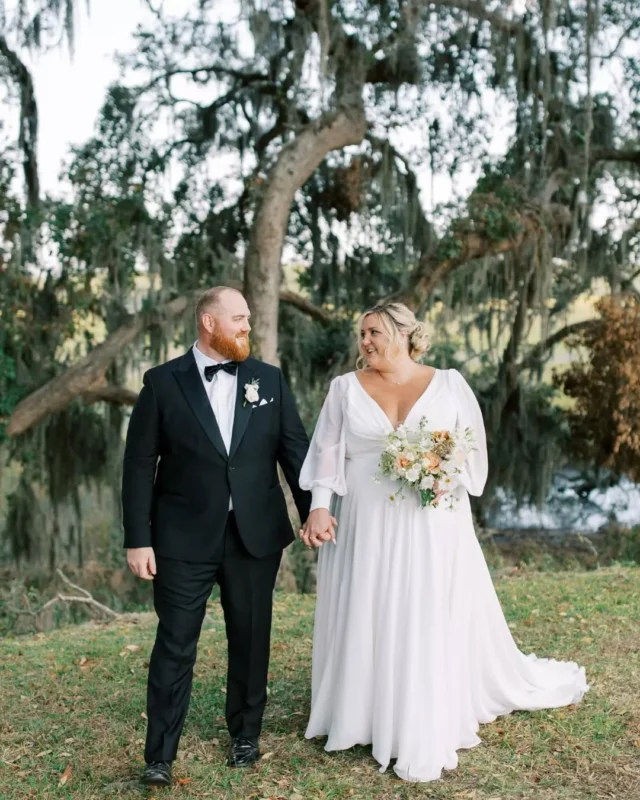Downtown Savannah doing what it does best—wrapping love stories in history, charm, and a touch of Southern magic.

Reception venue: @savannahbottleworks @fetewell
Ceremony venue: @bethesdaacademyweddings
Photographer: @mariannelucille
Planner: @spectacularsaturdaysweddings
Content creator: @bffofthebride
Hotel: @perrylanehotel
Hair: @enchantedsalonsav
Florals: @graceandthornsav
Bridal dress: @lovecurvybridal
Tux: @theblacktux
Bridesmaid dresses: @jadorebridal
Officiant: @reverendjoewadas
Trolley: @kellytours
Rentals: @eventworksrentals
DJ: @allaboutyouentertainment

#savannahgeorgiawedding #weddingportraits #georgiabride #historicsavannah #savannahgeorgia #georgiawedding #fetewell #weddingvenue #georgiaweddingvenue #savannahweddingvenue #fallwedding