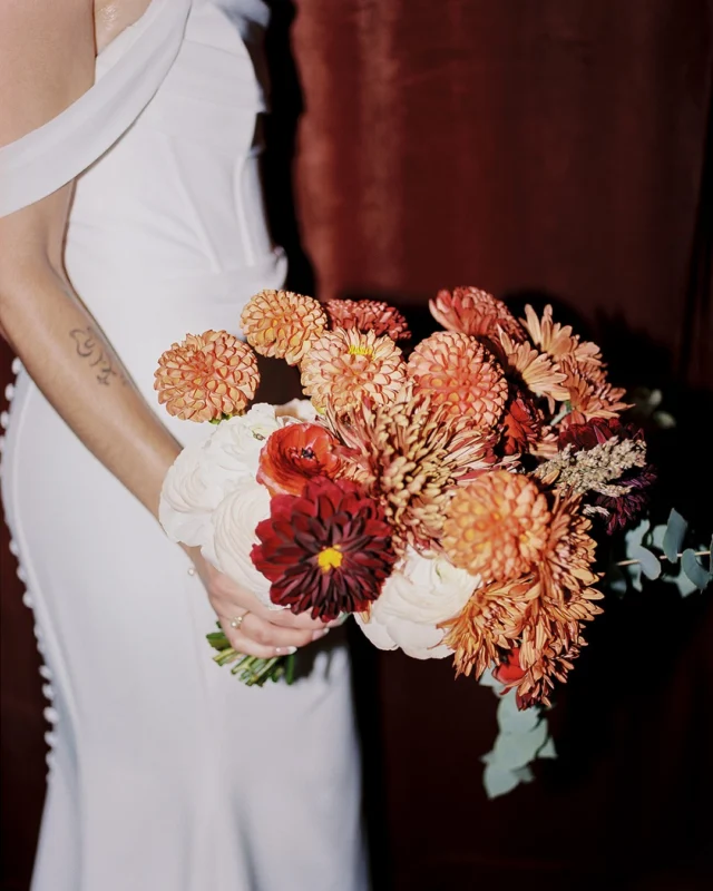 Our tip for building a fall palette? Start with the bouquet.

Paige’s, by @harrodhousecollective, was layered, textural and full of warm color, and it set the tone for everything that followed, from the rust and rose bridesmaid dresses to the final portraits. When the flowers lead, the whole palette feels collected and personal.

Planning a fall wedding at Main Street Ballroom? Save this one for palette inspiration.

@harrodhousecollective 
@mainstreetballroom @fetewell 
@rachelvking 
@eventscometrue_ 
@glamwithsam_andco 
@dj_joshallen 
@libscatering 
@vowdweddings 
@christopherschafer 
@tattoosbymeach 
@lauramcmullinphotography 
@officiantnate